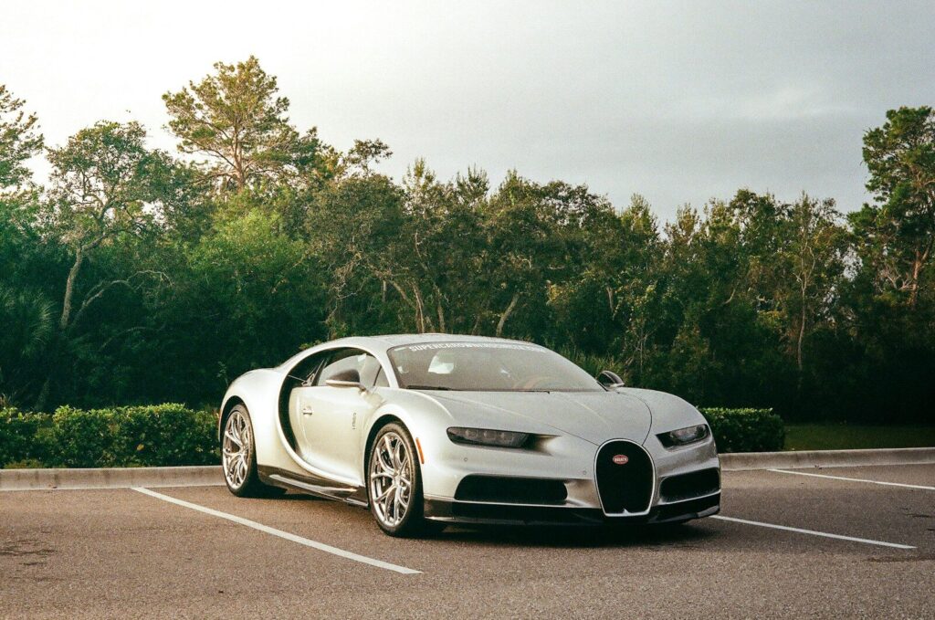 Silver luxury sports car parked in a lot