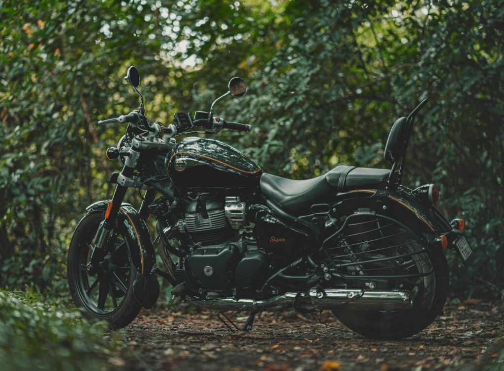 A motorcycle parked in the middle of a forest