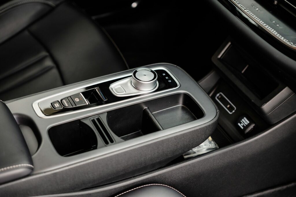 Modern car interior with gear shifter and cup holders