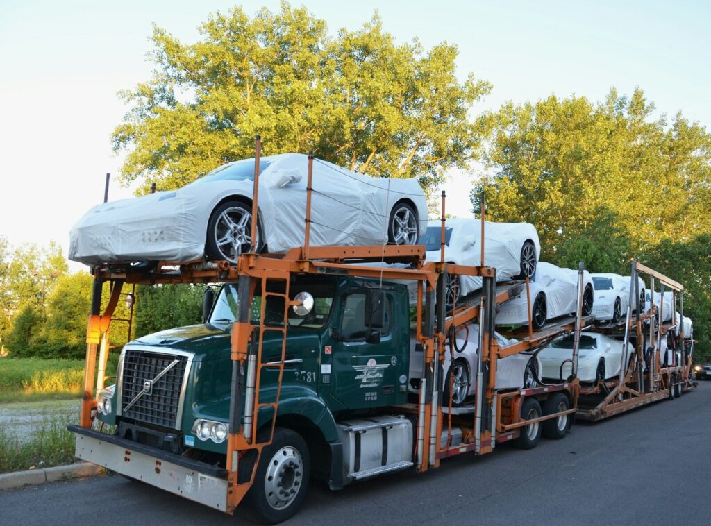 A truck with a car on the back of it