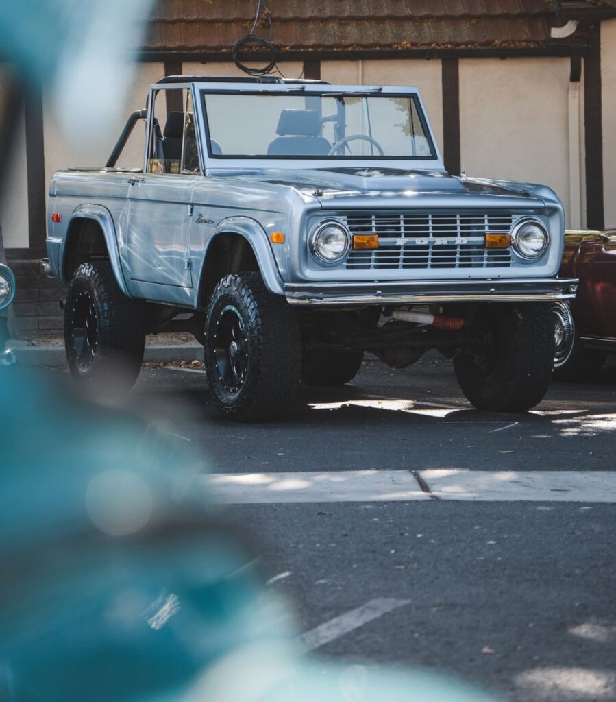 Classic silver Ford Bronco parked outdoors, showcasing iconic design and off-road capability.