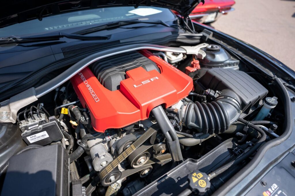 Detailed view of a supercharged LSA engine in a car.