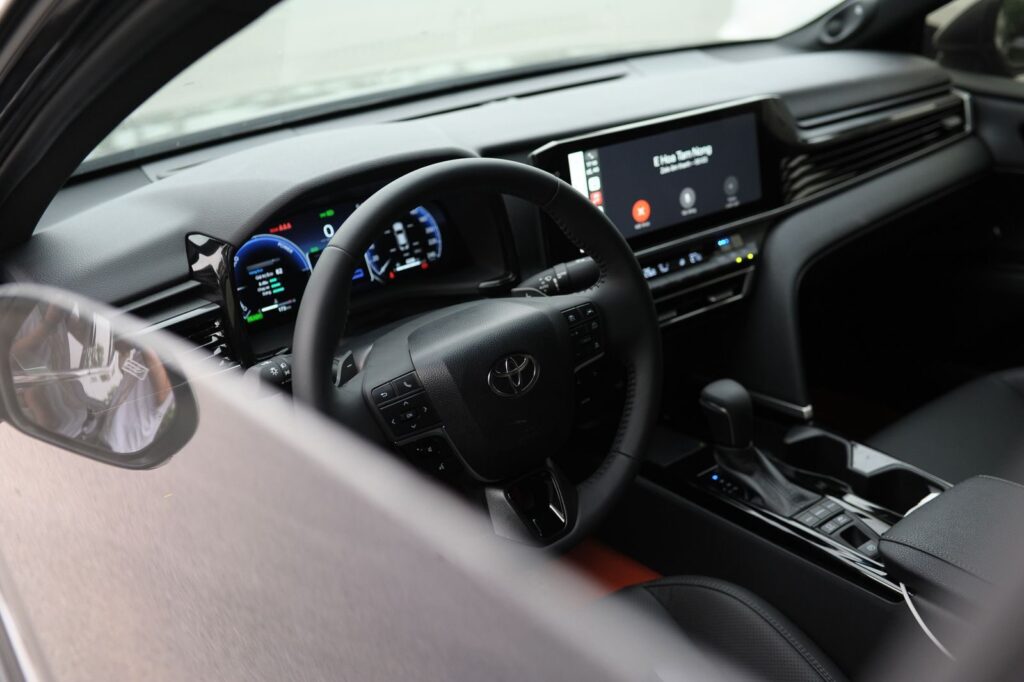 High-tech interior of a modern car featuring dashboard and digital display.
